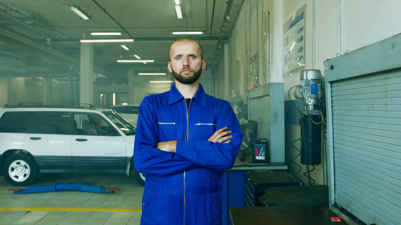 pexels-photo-8985464 Professional mechanic in a repair shop, focused on car maintenance and vehicle service.
